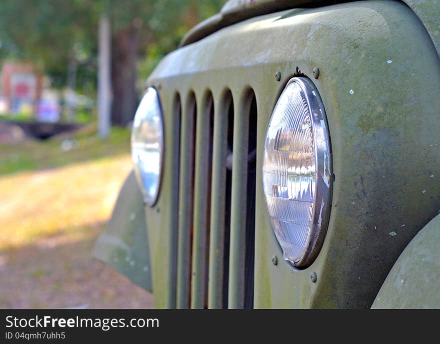 Headlights and grille on an old and abandoned military jeep. Headlights and grille on an old and abandoned military jeep.