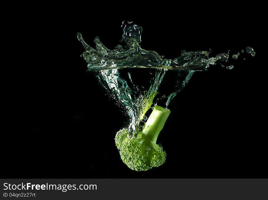 Picture of a vegetable - broccoli dropped under water. Picture of a vegetable - broccoli dropped under water