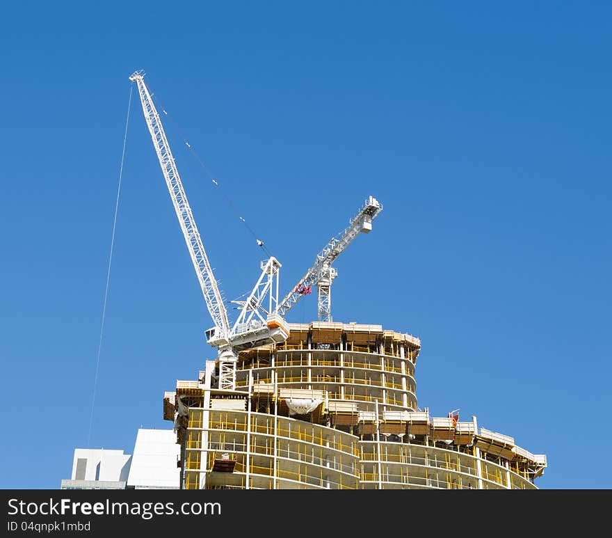 Condominium tower under construction with crane. Condominium tower under construction with crane