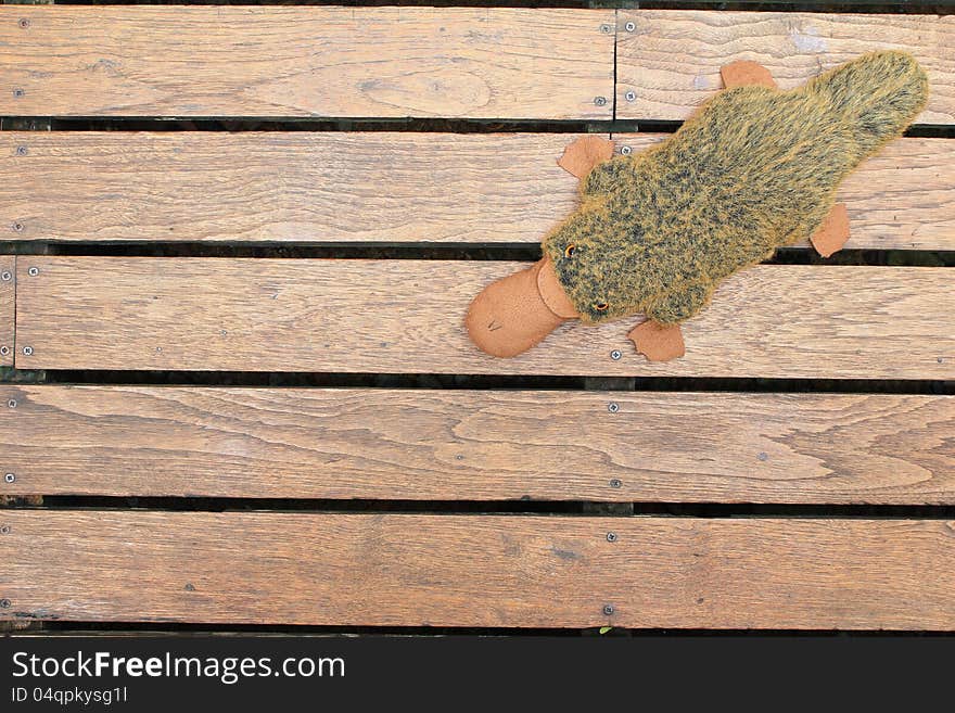 Old wooden background with doll