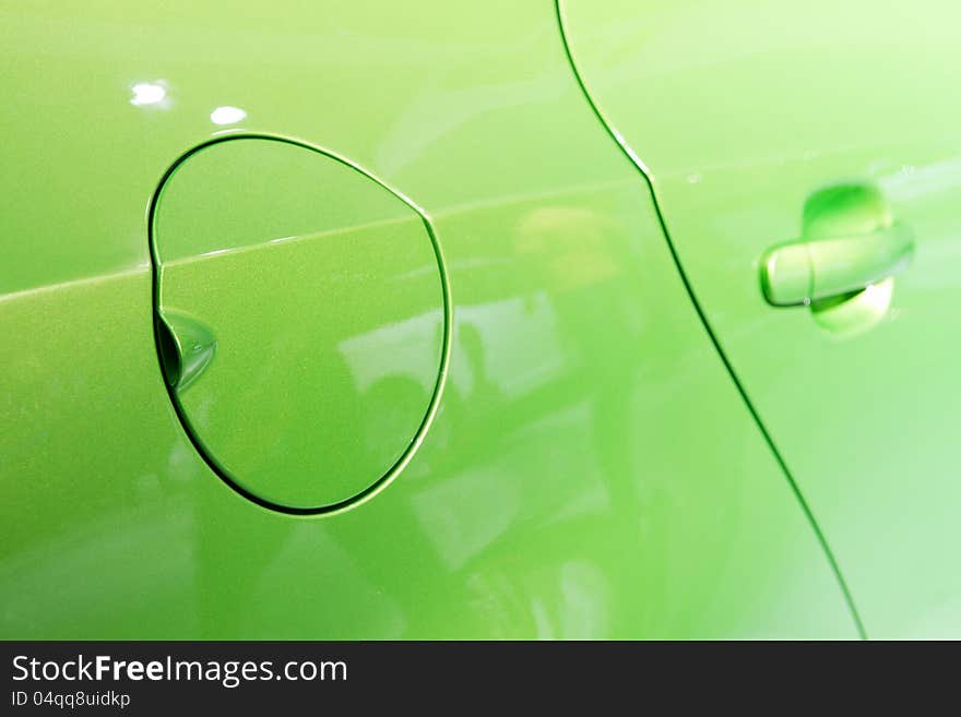 A close up of a petrol cap cover on a modern car