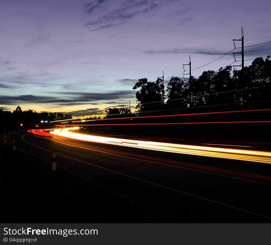 Light vehicles on the road in the evening. Light vehicles on the road in the evening.