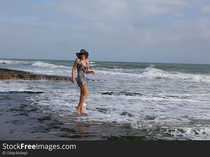 Beauty woman silhouette over sea wave. Beauty woman silhouette over sea wave