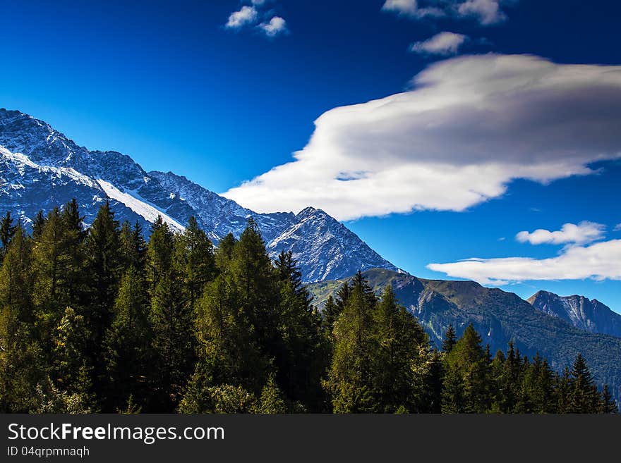 Snow covered mountains and rocky peaks in the French Alps in the Mont Blanc Massif. Snow covered mountains and rocky peaks in the French Alps in the Mont Blanc Massif