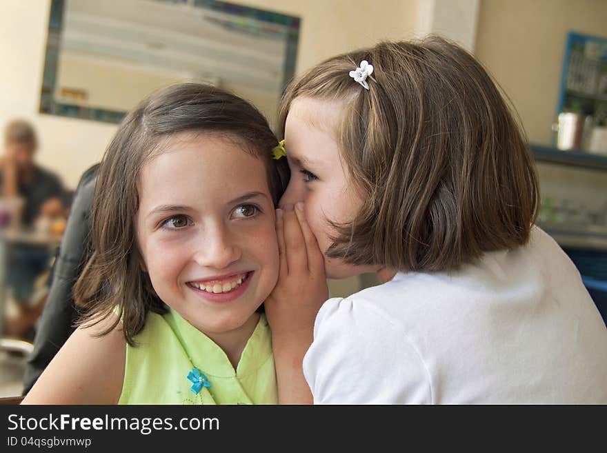 Sisters Whispering On The Ear