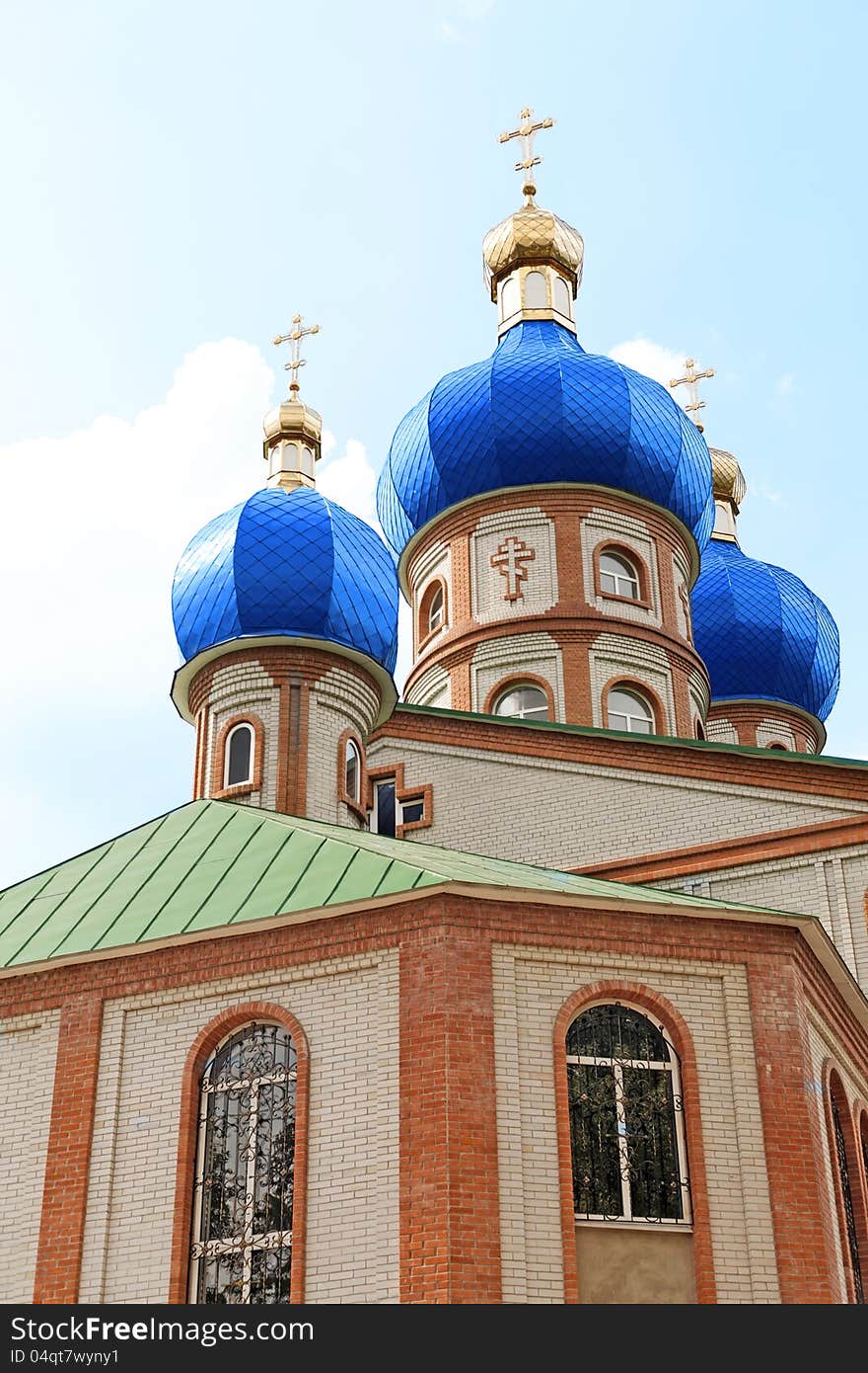 Church with blue domes against the sky