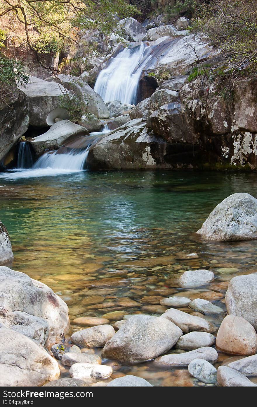 This photo clearly captures the scene of green trees, rusty natural orange peddle and flowing water. This photo clearly captures the scene of green trees, rusty natural orange peddle and flowing water.