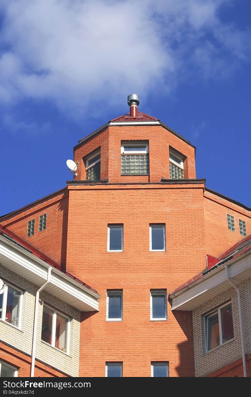 Photo of big protected modern house against blue sky. Photo of big protected modern house against blue sky