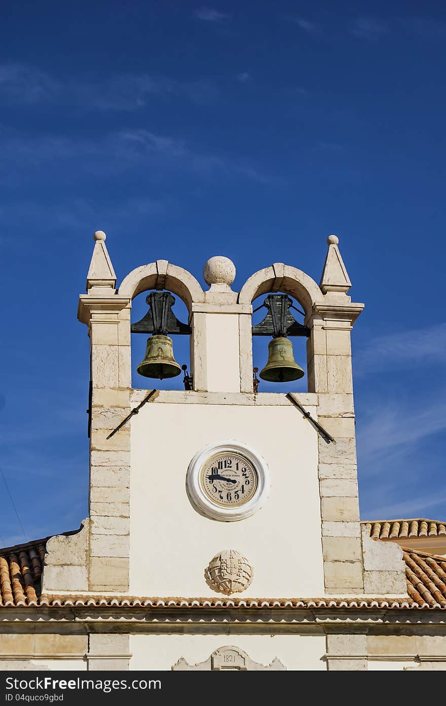 Clock tower with two bells. Clock tower with two bells.