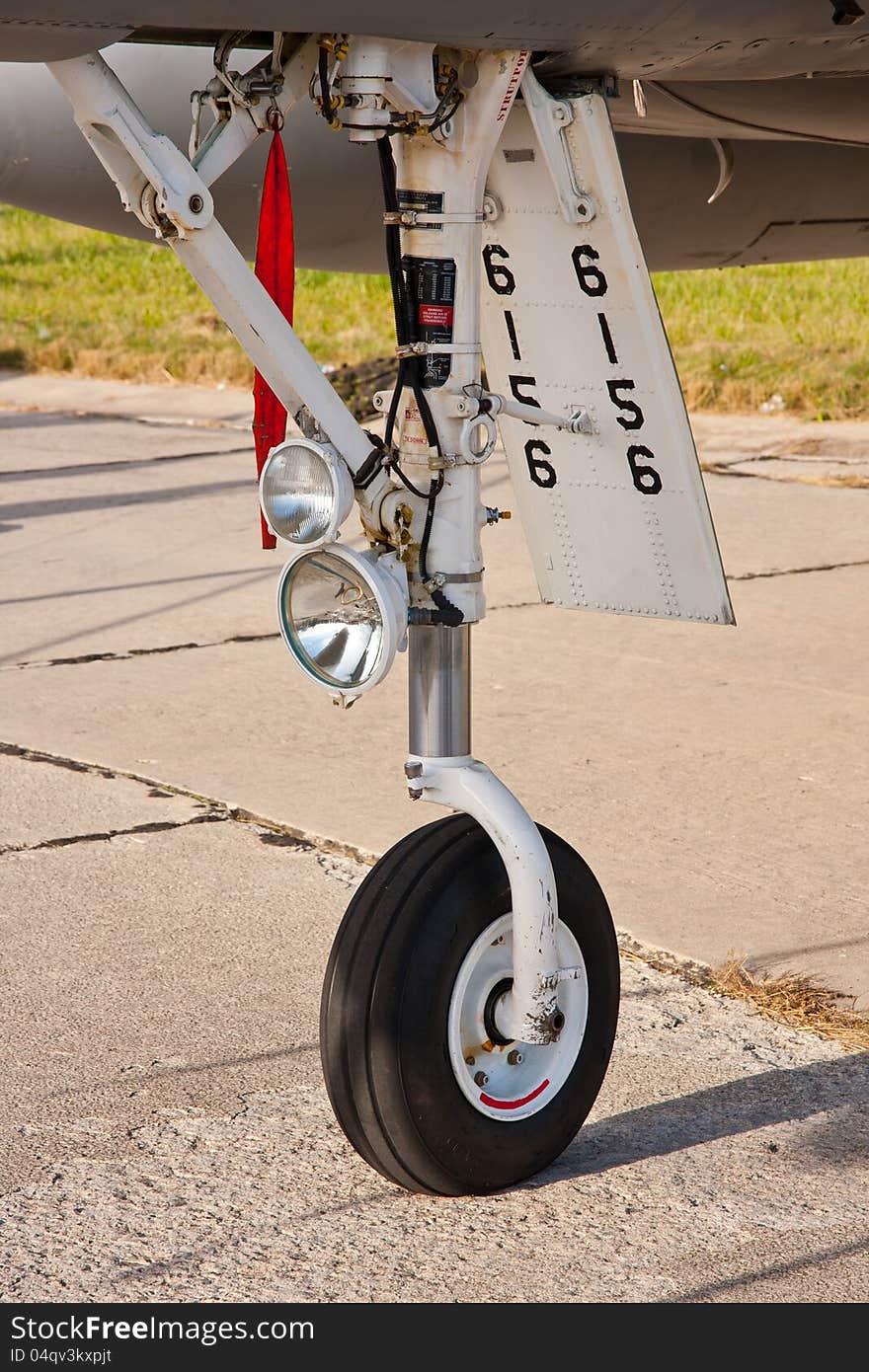 Close up of front wheel in military airplane. Close up of front wheel in military airplane