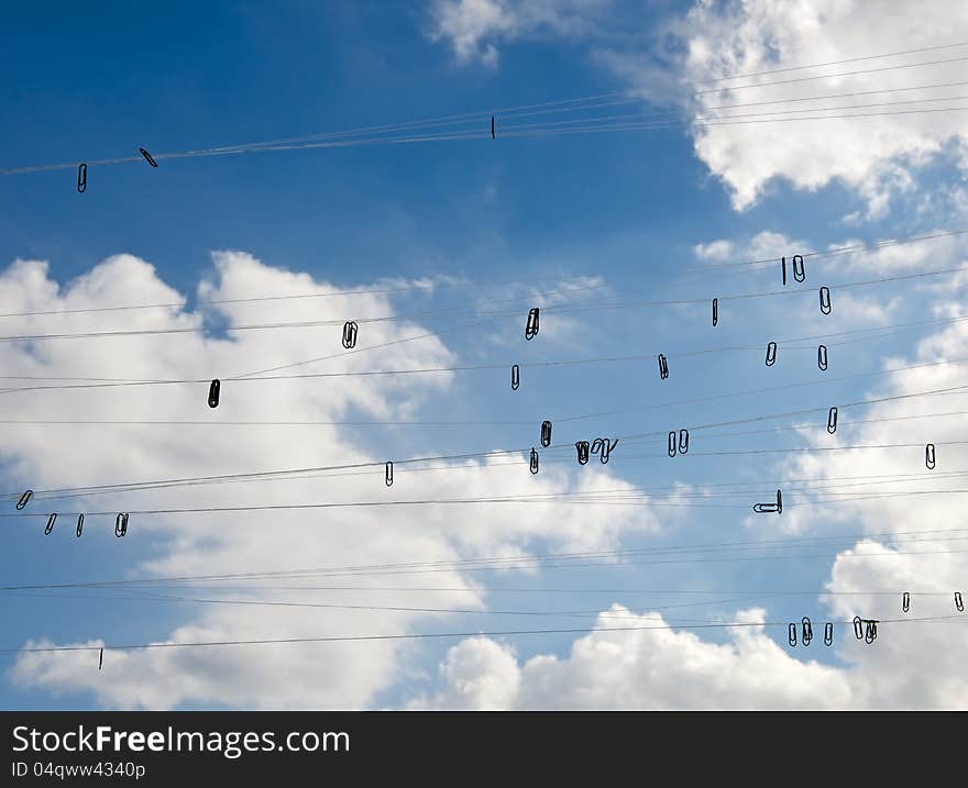 Against the background of the blue sky cloud visible fishing line hanging from her staples. This symbolizes instolyatsiya thoughts and ideas come to mind of man. Against the background of the blue sky cloud visible fishing line hanging from her staples. This symbolizes instolyatsiya thoughts and ideas come to mind of man.