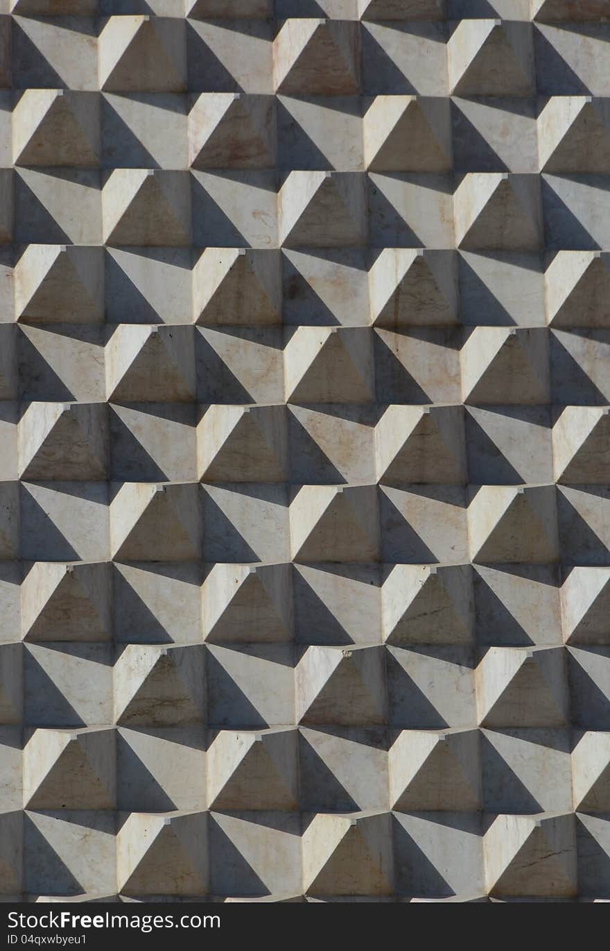 Marble pyramids on wall