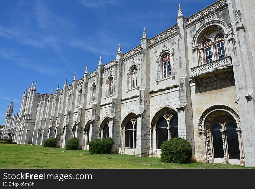 The elaborately ornamented facade of the ancient Monastery of Jeronimos in Lisbon, Portugal. The elaborately ornamented facade of the ancient Monastery of Jeronimos in Lisbon, Portugal