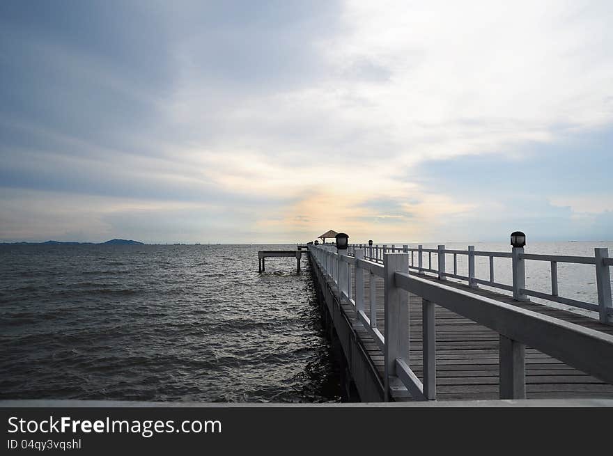 Wooden bridge into the sea. Wooden bridge into the sea