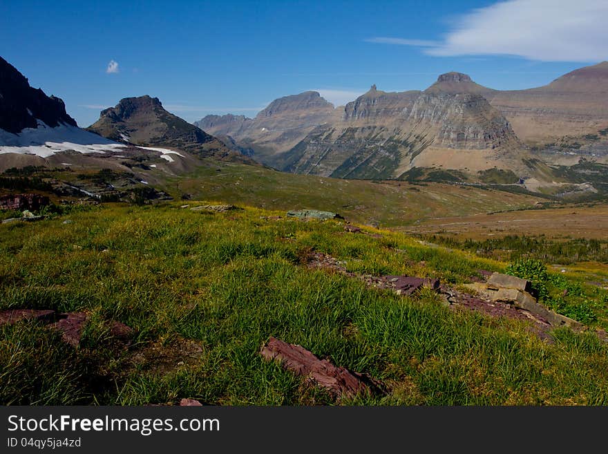 This image was taken from near a climbers path to Mt Reynolds in Glacier National Park and shows the Logan Pass area with the Garden Wall in the background. This image was taken from near a climbers path to Mt Reynolds in Glacier National Park and shows the Logan Pass area with the Garden Wall in the background.