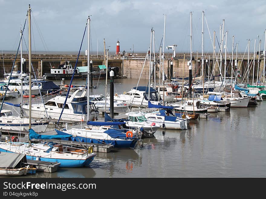 A Collection of Boats Moored in a Coastal Harbour.