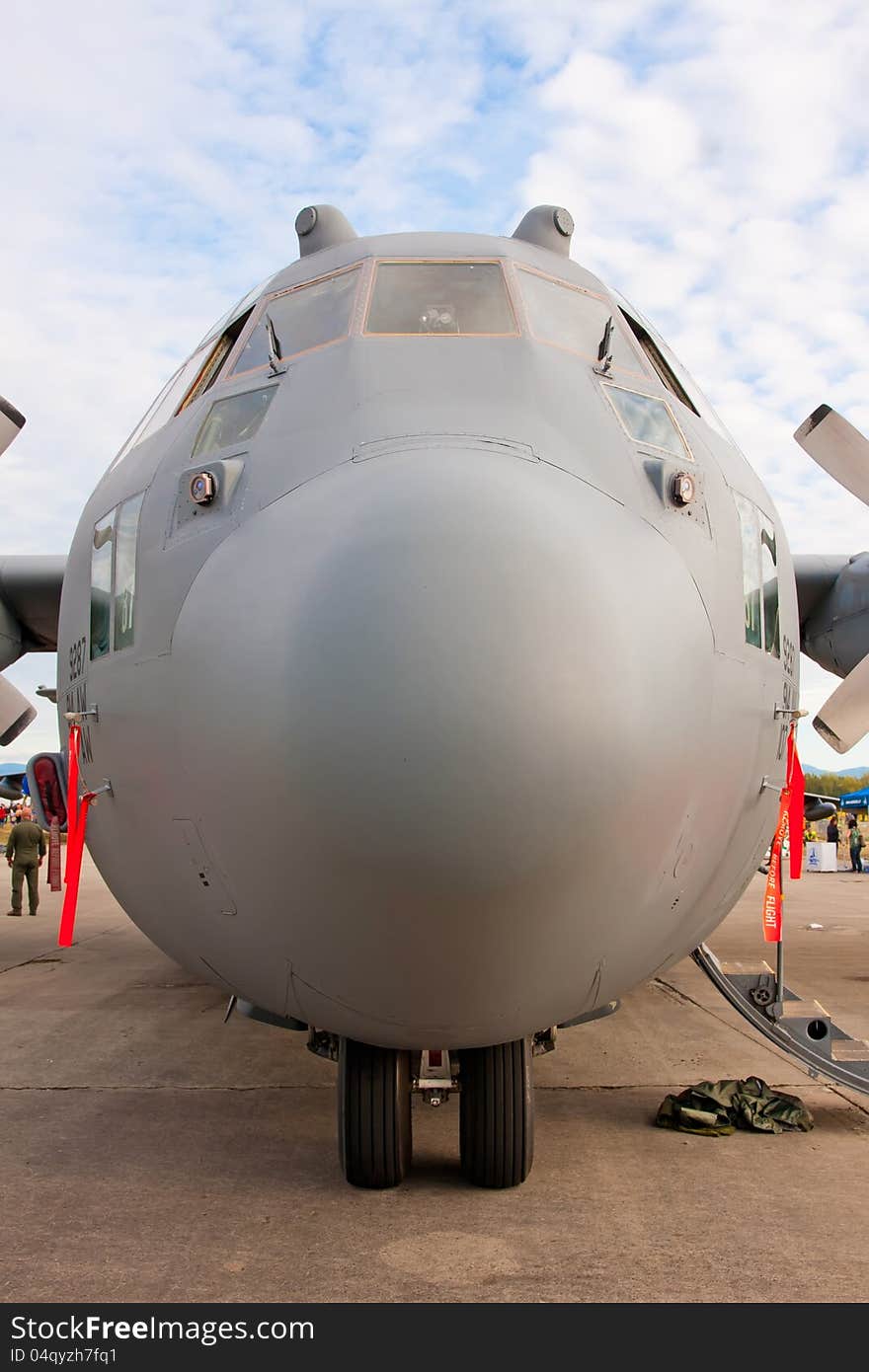 Nose view of Lockheed C-130 Hercules - modern military airplane on the ground. Nose view of Lockheed C-130 Hercules - modern military airplane on the ground