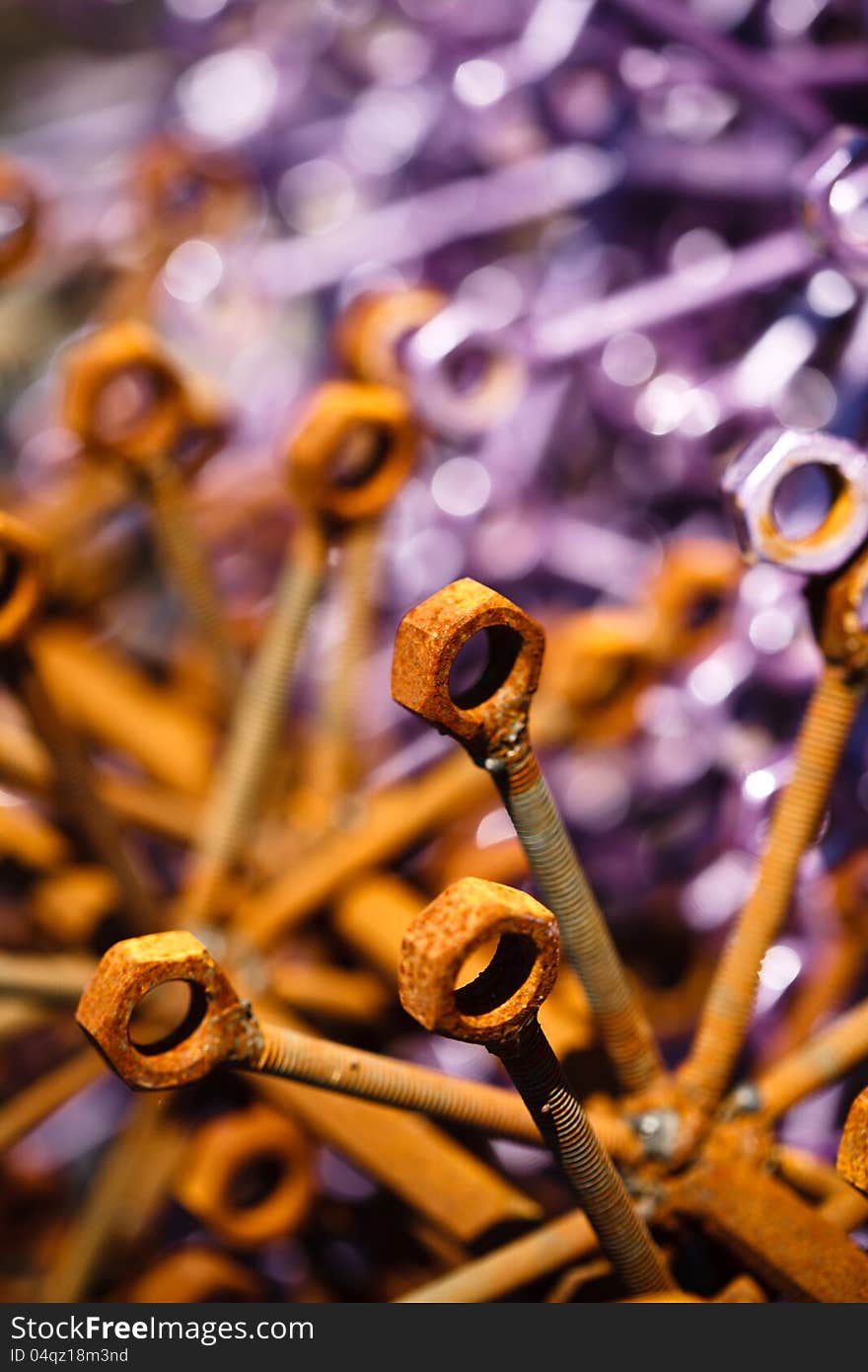 Colored and rusty nuts and bolts