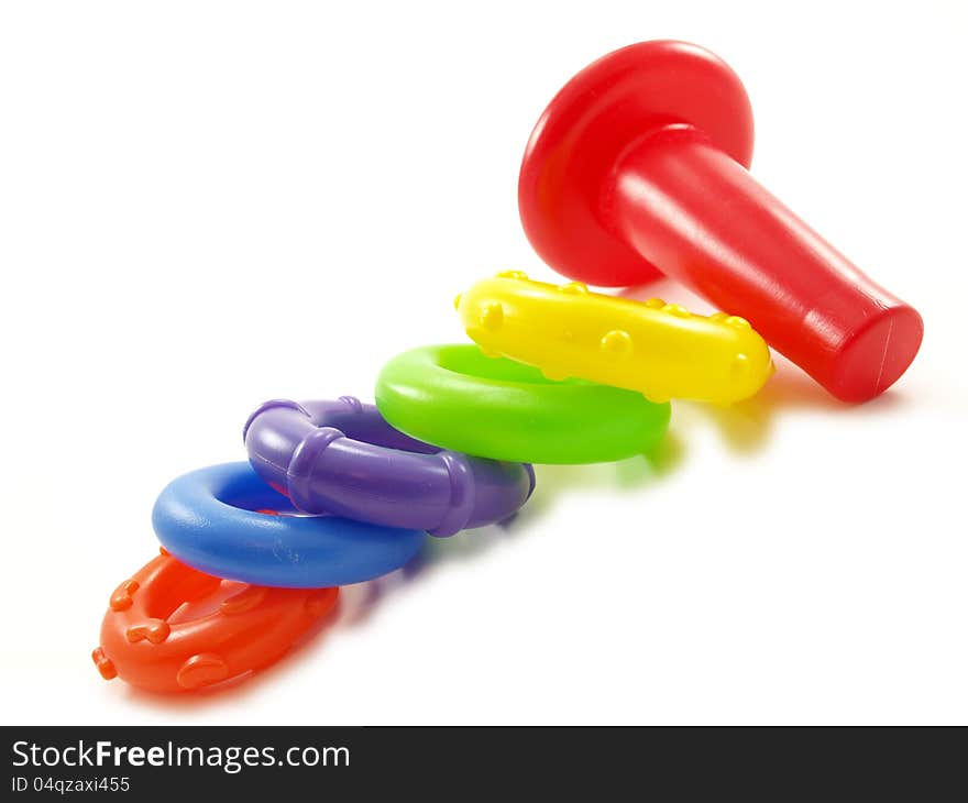 Colorful plastic pyramid toy on white background