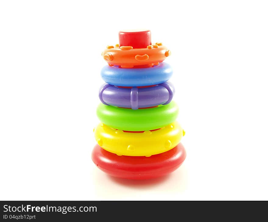 Colorful plastic pyramid toy  on white background