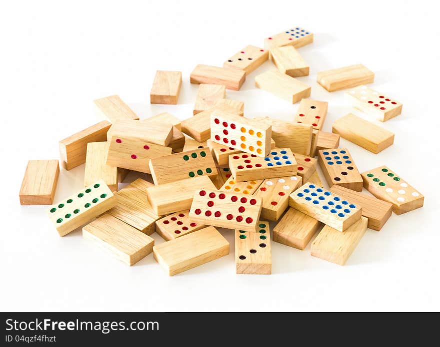 Chaotic heap of wooden domino on white background. Chaotic heap of wooden domino on white background