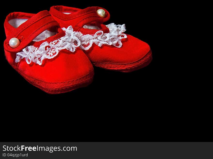 Red baby booties with white lace trim. Red baby booties with white lace trim