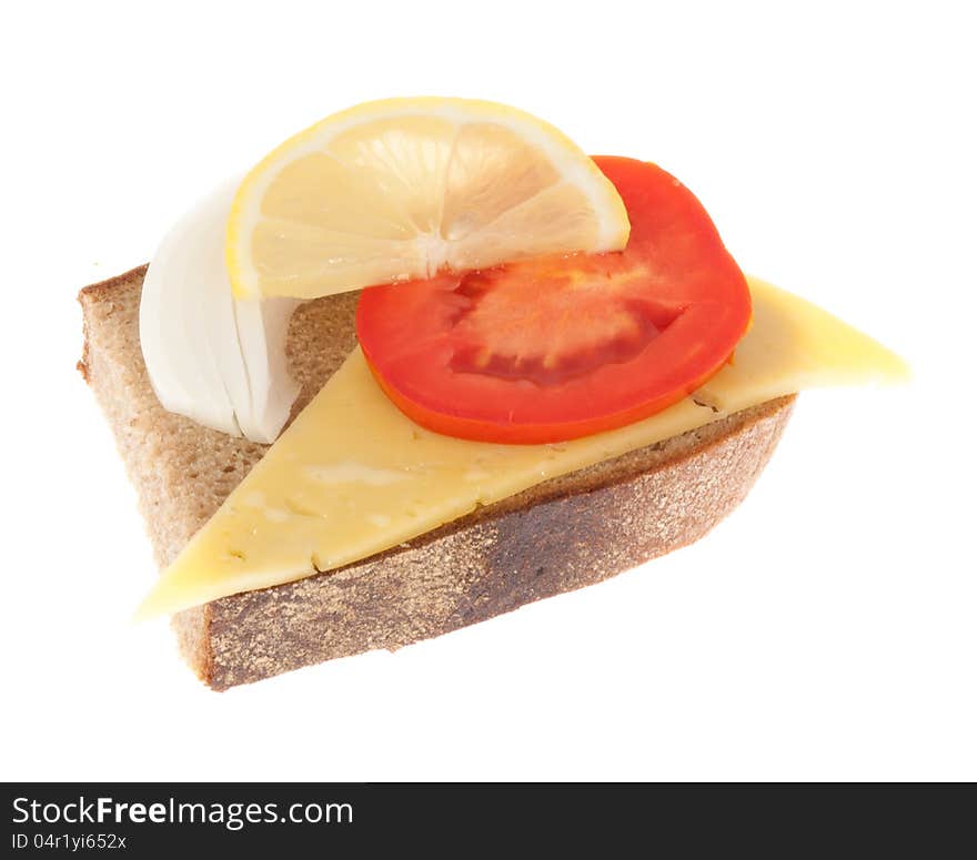 Rye-bread with cheese, tomato, onion and lemon. Isolated on a white background.