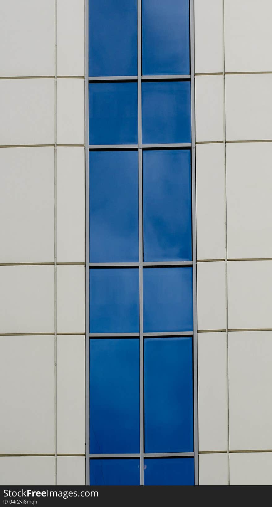 Blue sky reflected in the windows of office building. Blue sky reflected in the windows of office building