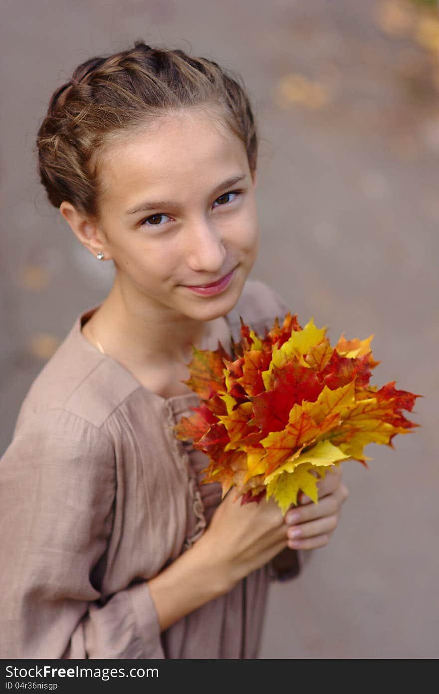 Portrait Of Girl With Maple Leaves