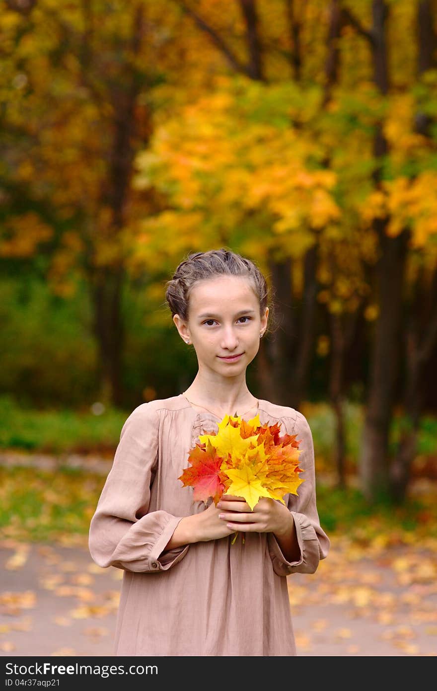 Portrait of Girl with maple leaves