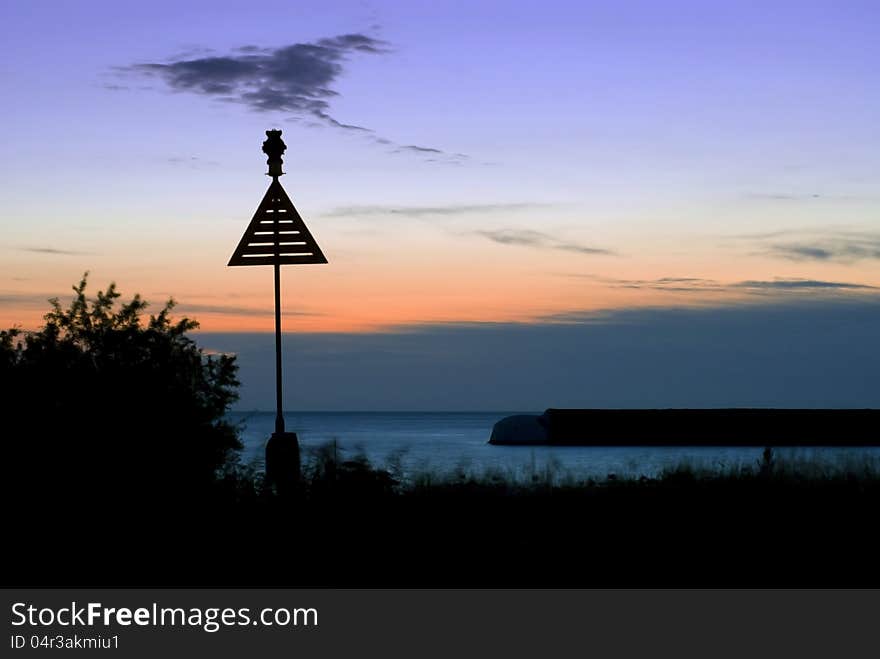 Starboard sea mark, with beautiful sunrise in background