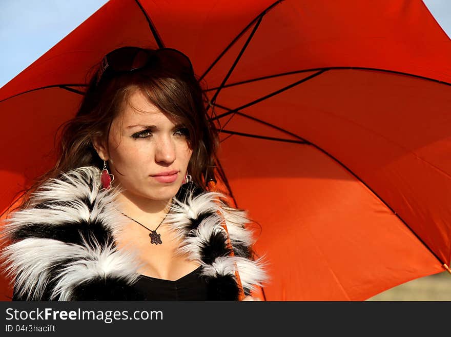 Girl with orange umbrella outdoor. Girl with orange umbrella outdoor