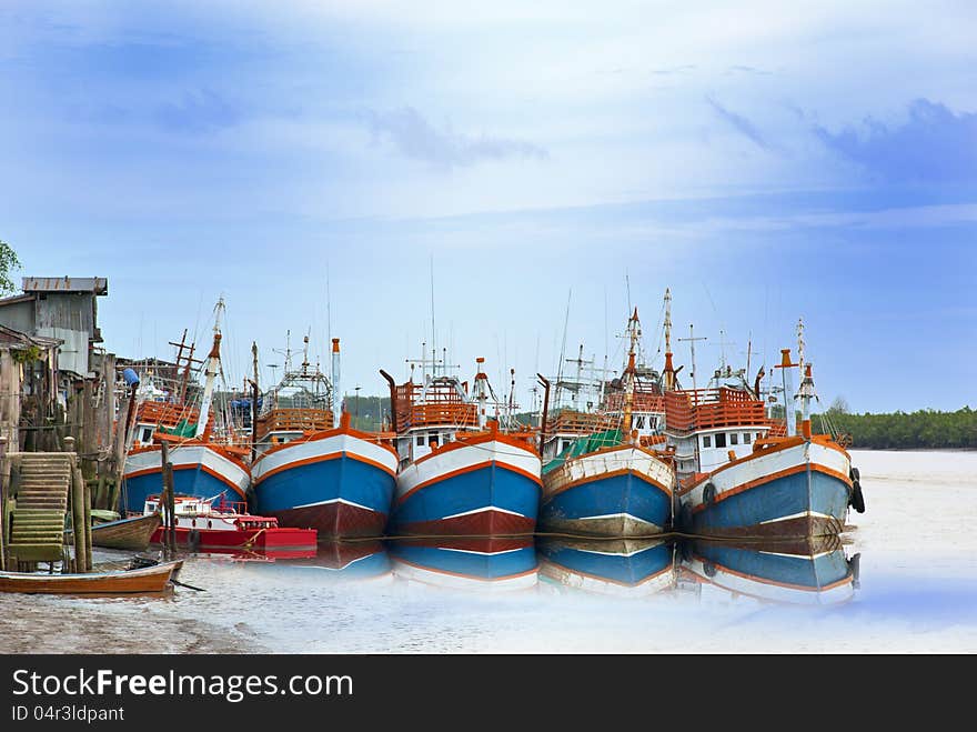 Five of fishing boats park at Pier.