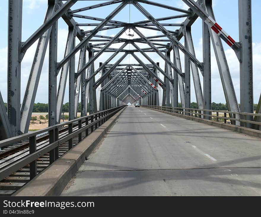 Australia. Queensland. Car and simultaneously railway iron bridge through river. Australia. Queensland. Car and simultaneously railway iron bridge through river.