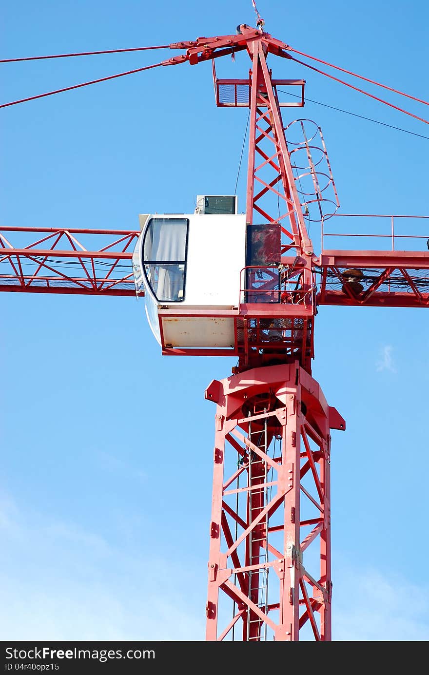 The construction crane on day with sky