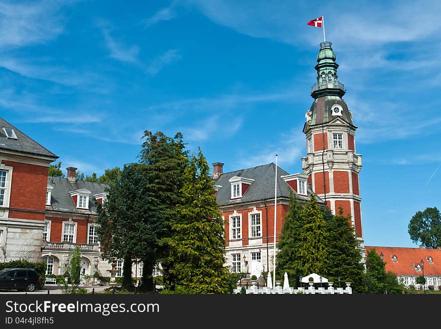 Hvedholm castle slot landmark fairy tale castle in Funen Denmark view of the main building. Hvedholm castle slot landmark fairy tale castle in Funen Denmark view of the main building