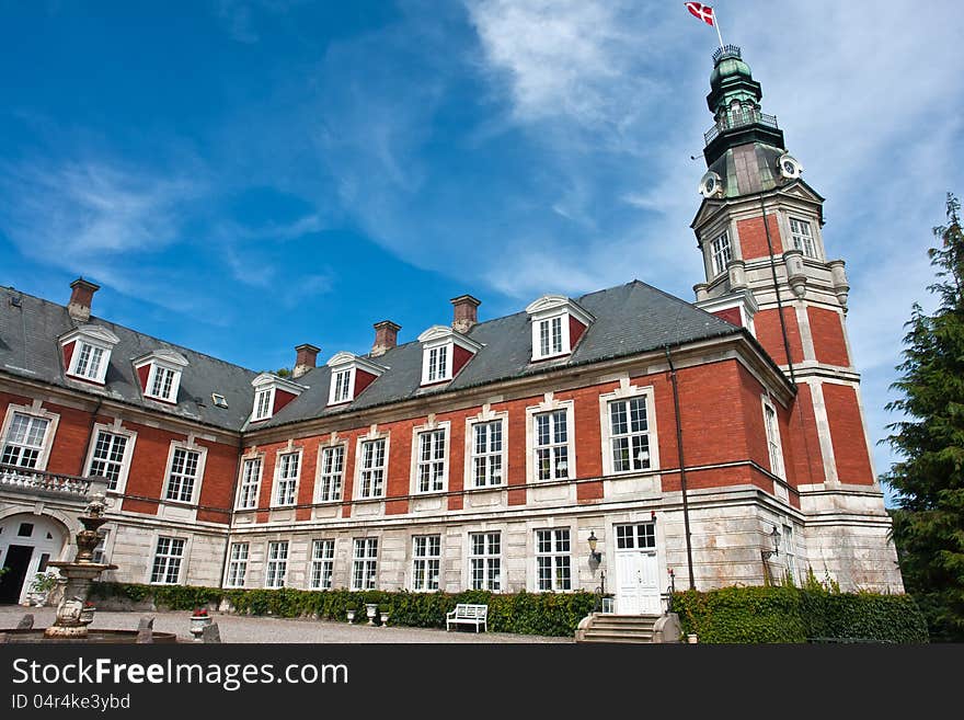 Hvedholm castle slot landmark fairy tale castle in Funen Denmark view of the main building. Hvedholm castle slot landmark fairy tale castle in Funen Denmark view of the main building