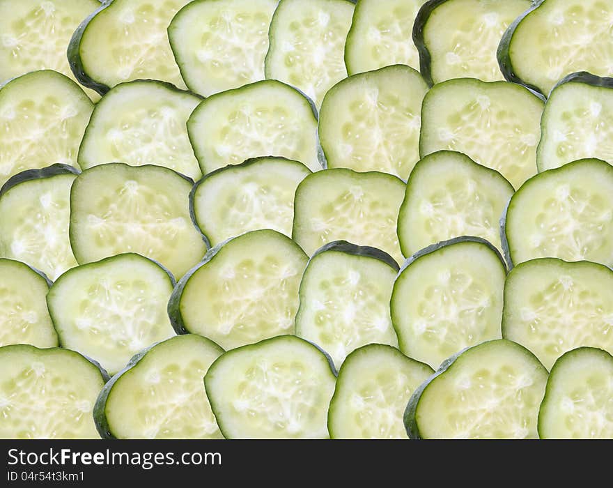 Background made from lot of freshness green sliced cucumbers. Background made from lot of freshness green sliced cucumbers