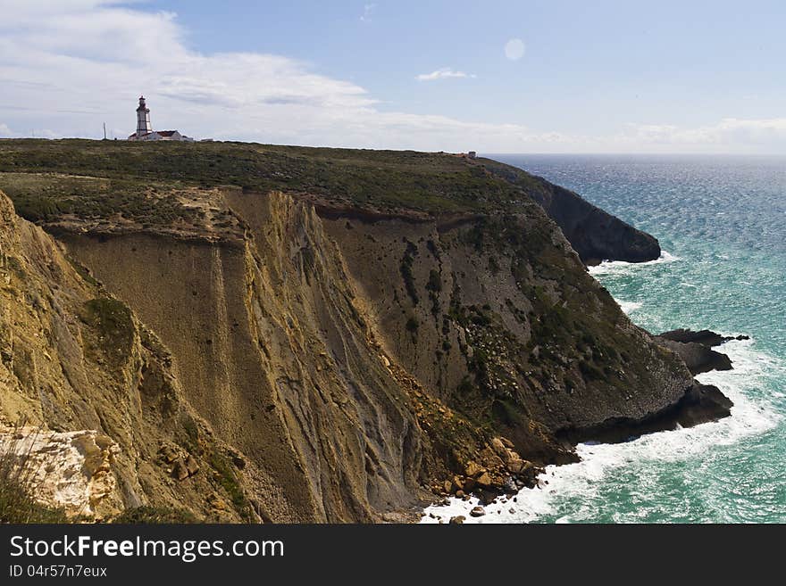 View of the beautiful lighthouse of Cape Espichel, Sesimbra, Portugal.