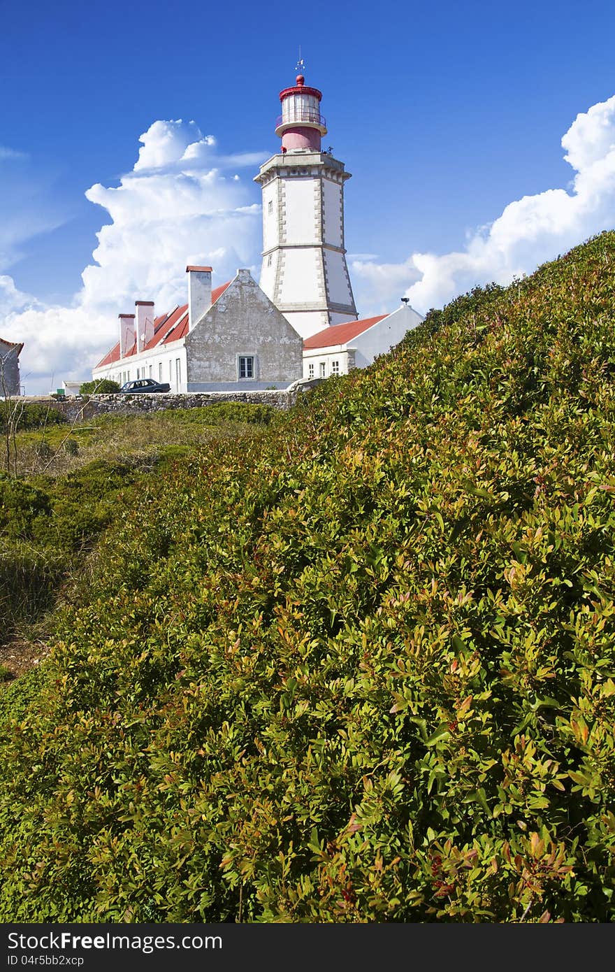 View of the beautiful lighthouse of Cape Espichel, Sesimbra, Portugal.