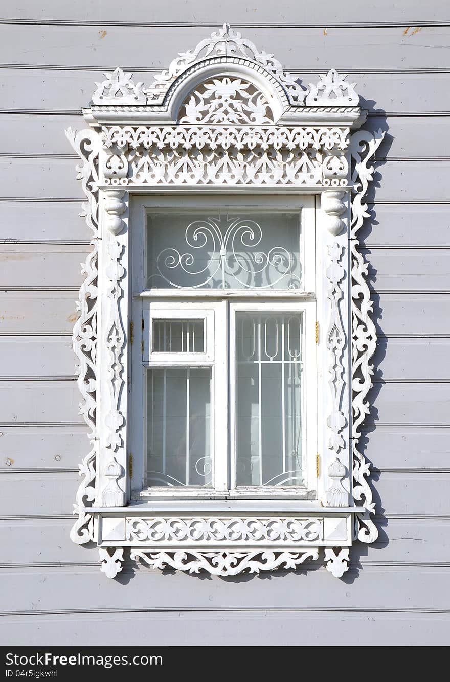 The white carved wooden window. The white carved wooden window