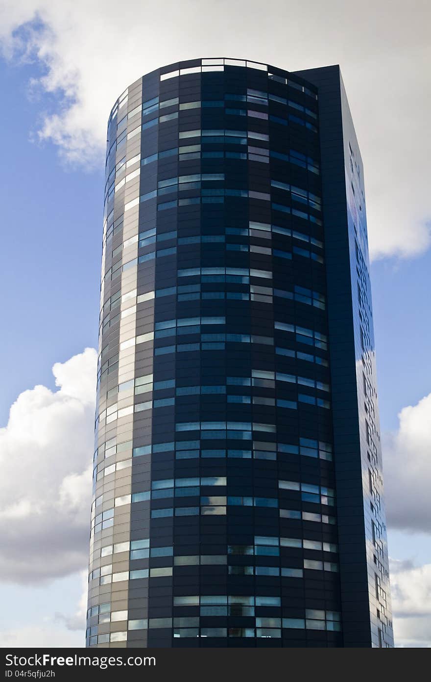 View of a beautiful and modern glass building. View of a beautiful and modern glass building.