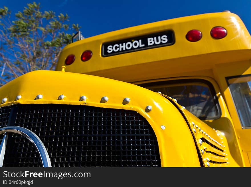 Front of Yellow School Bus with Blue Sky