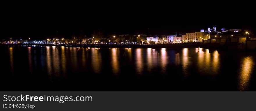 View of beautiful Tavira city in the night located in the Algarve, Portugal. View of beautiful Tavira city in the night located in the Algarve, Portugal.