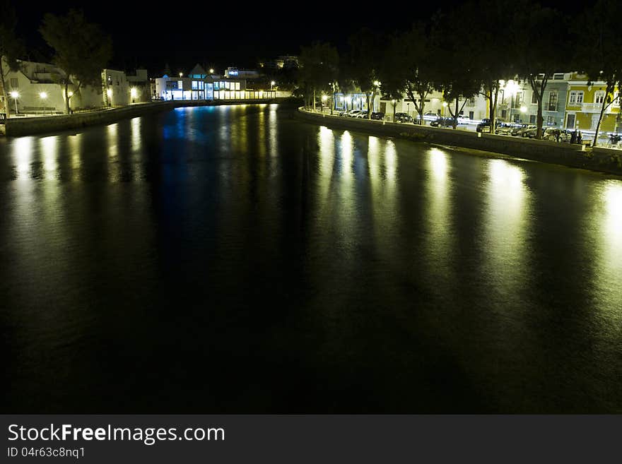 View of beautiful Tavira city in the night located in the Algarve, Portugal. View of beautiful Tavira city in the night located in the Algarve, Portugal.