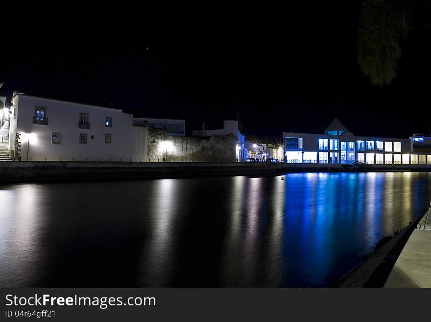 View of beautiful Tavira city in the night located in the Algarve, Portugal. View of beautiful Tavira city in the night located in the Algarve, Portugal.