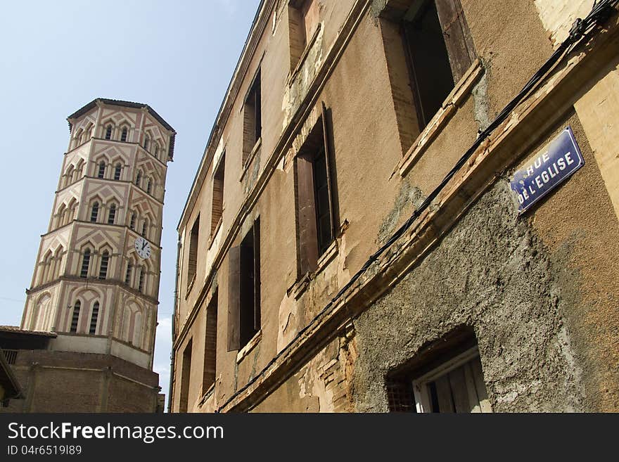 View from approaching street of the octagonal bell tower in Lombez, southern France. View from approaching street of the octagonal bell tower in Lombez, southern France