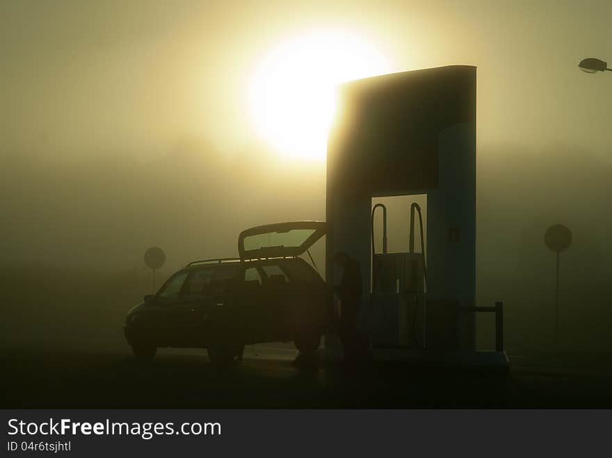 In the foggy morning at filling station. In the foggy morning at filling station