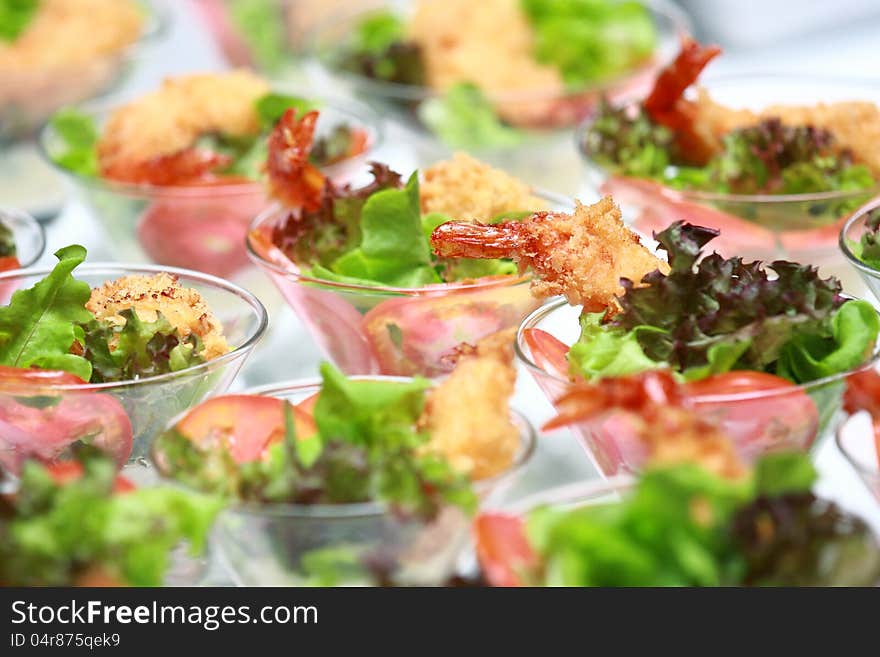 Row shrimps cocktail salad on white background