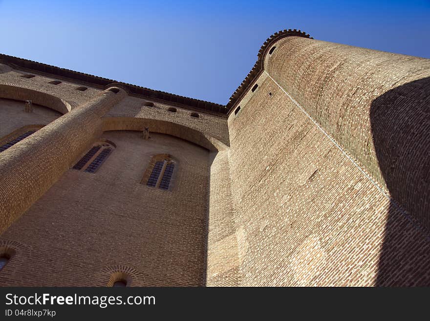 View looking up at the massive structure in southern France, claimed to be the largest brick building in the world. View looking up at the massive structure in southern France, claimed to be the largest brick building in the world